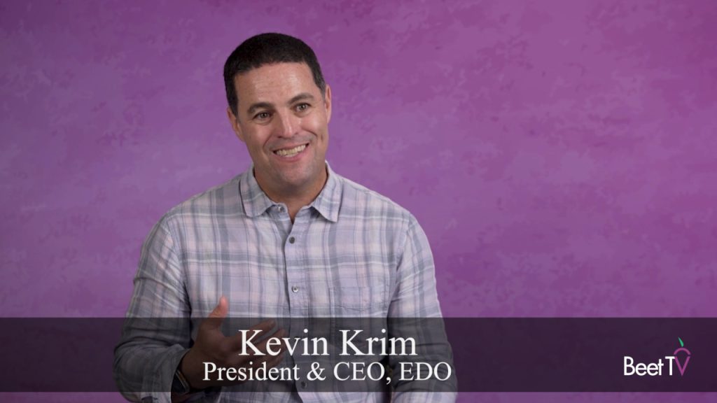 EDO CEO Kevin Krim speaking at a conference