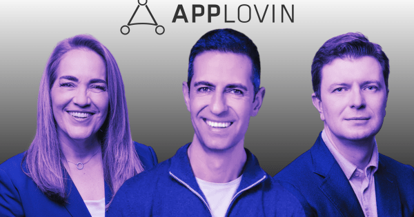 AppLovin CEO Adam Foroughi shakes hands with new board chair Craig Billings against mobile ad backdrop