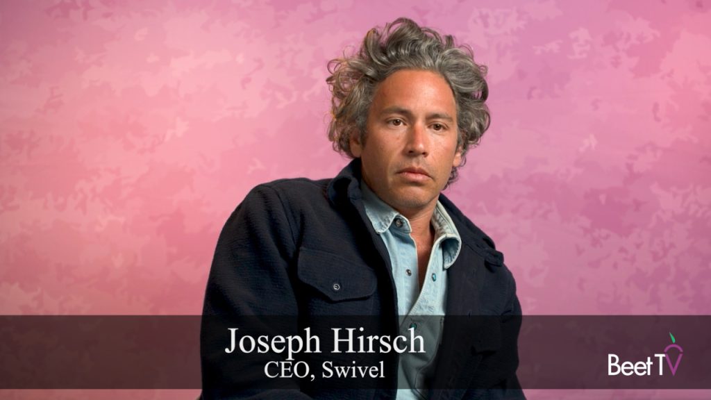 Joseph Hirsch, CEO of Swivel, speaking at an industry event.