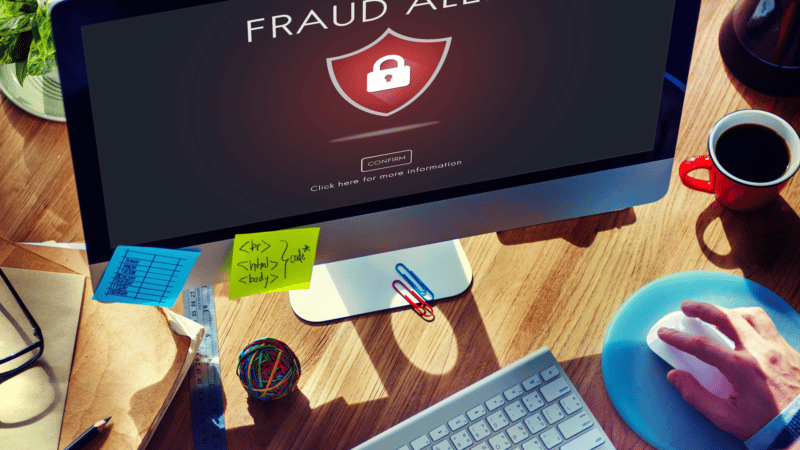A magnifying glass hovering over a complex network diagram, symbolizing the search for ad fraud.