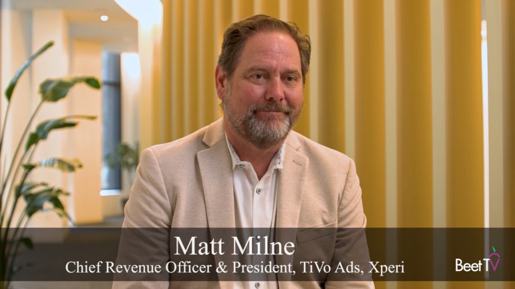 A stylized graphic representing a TV home screen with ad elements overlaid.