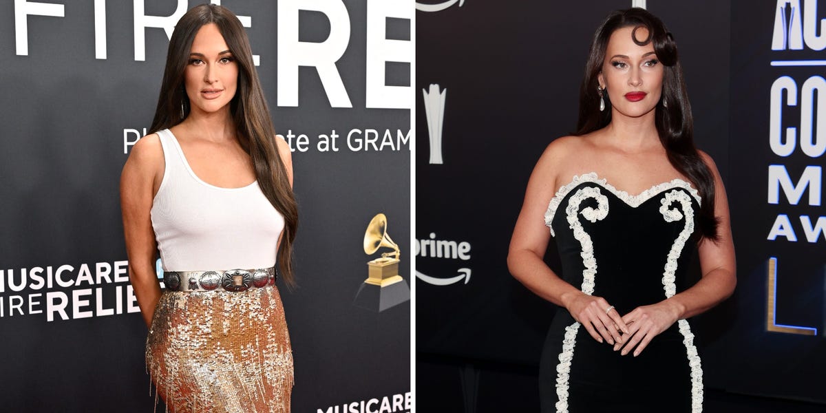 Kacey Musgraves posing on a red carpet in a dramatic feathered gown.