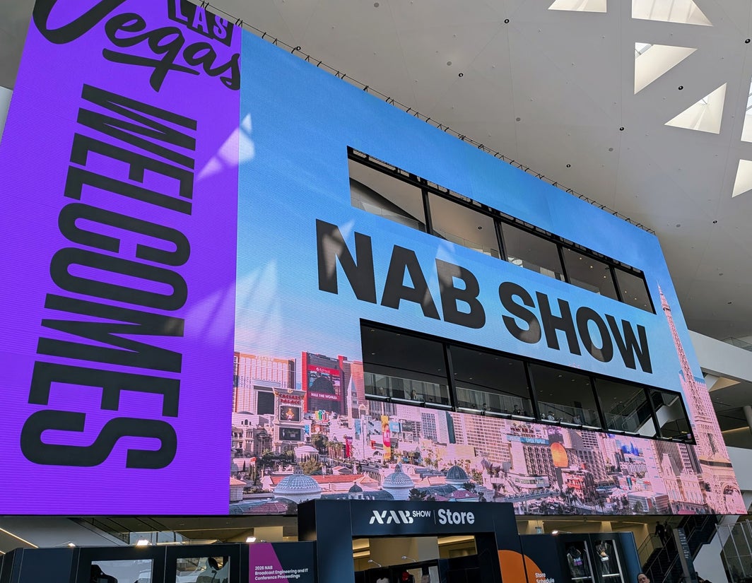 A crowd gathered around an interactive demo booth at NAB 2026.