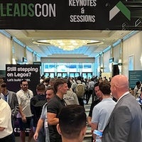 A split image showing a red downward trending graph on one side and a green upward trending graph on the other.