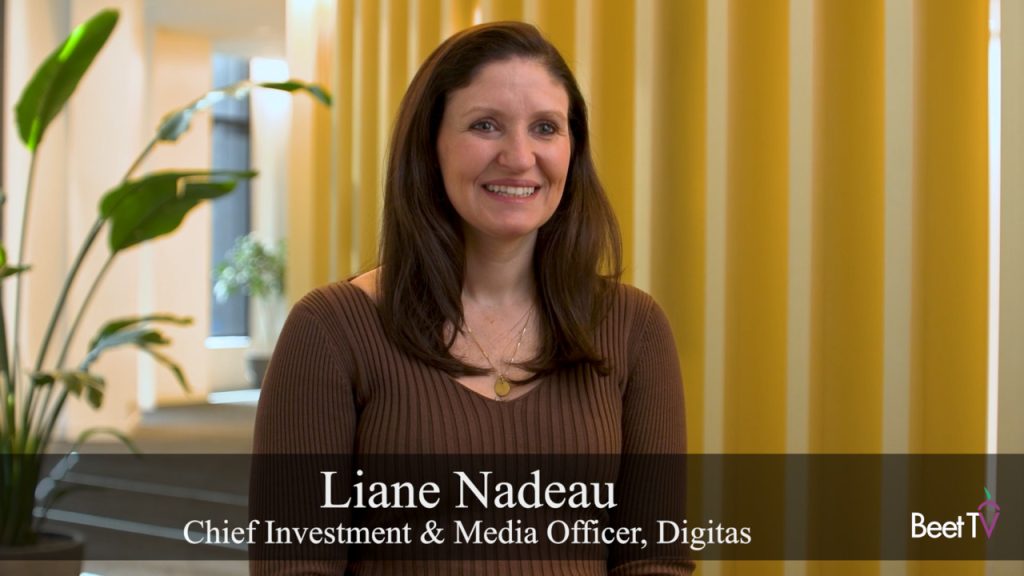 Liane Nadeau speaking at IAB NewFronts on stage with microphone