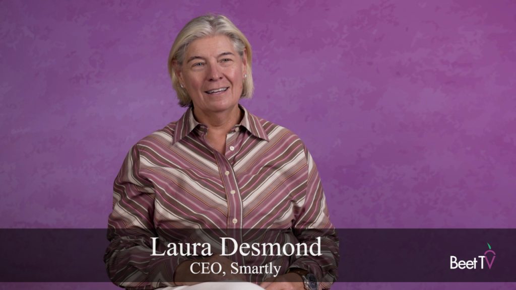 Laura Desmond, CEO of Smartly, speaking at a conference.