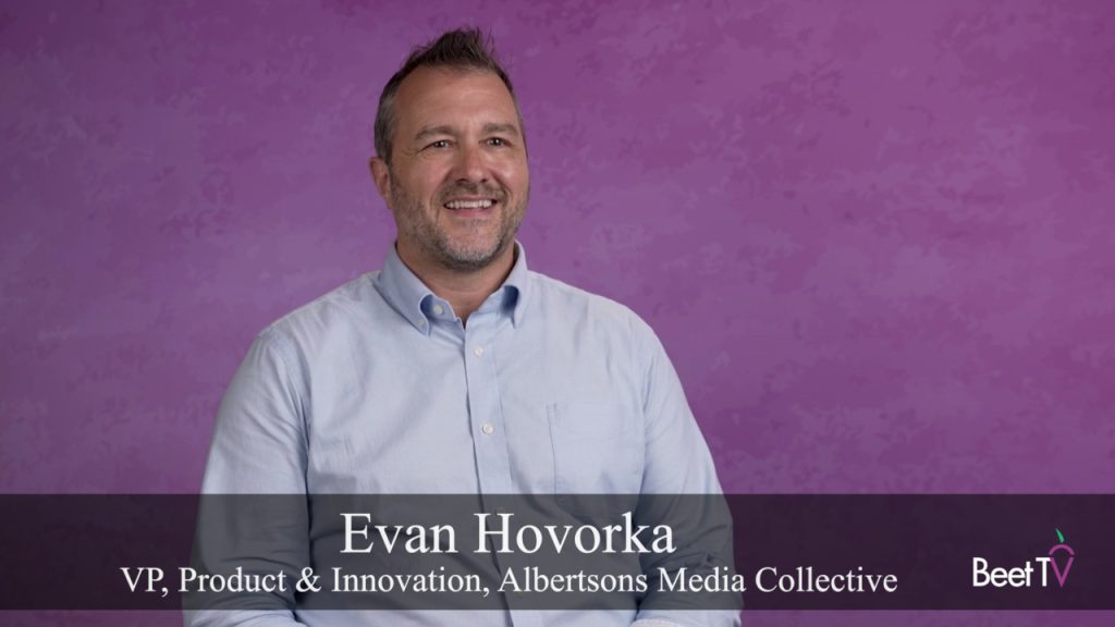 Evan Hovorka speaking at a conference.