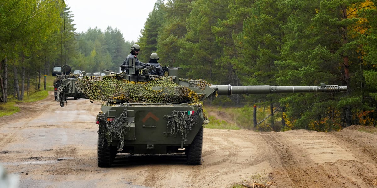 An Italian B1 Centauro tank in a defensive position with anti-drone netting.