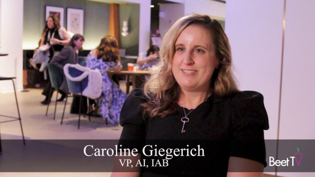 Caroline Giegerich, VP of AI at IAB, speaking at a conference.